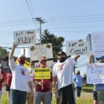 mon school protesters with signs